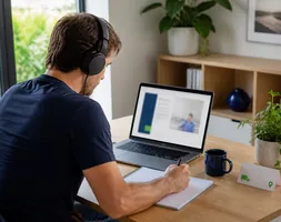 Learner completing self-paced online first aid theory at home on a laptop